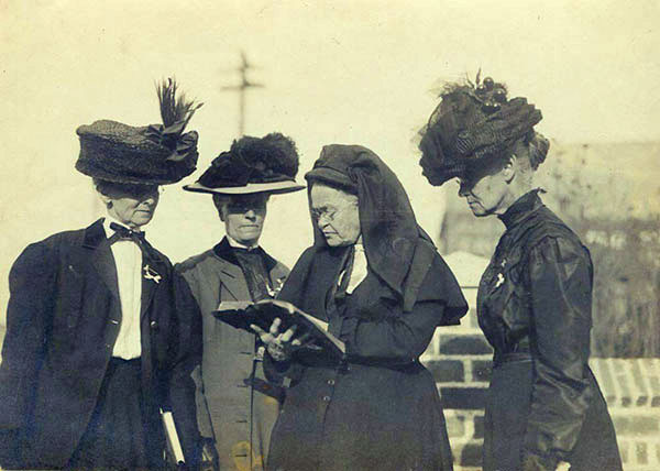 Carry Nation, reading the Bible circa 1900, appears to be of medium height.