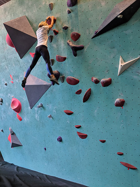 Aimee Bissonette climbing one of the walls at the Minneapolis Bouldering Project.