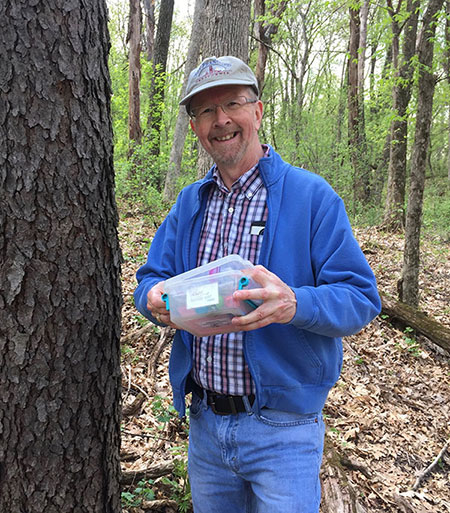 My friend Gary with a geocache