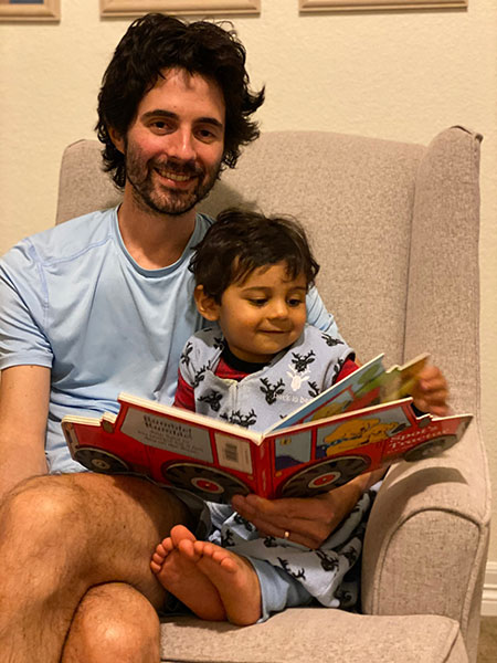 Nikhil shares a book with his dad (and Connie’s son) Phill