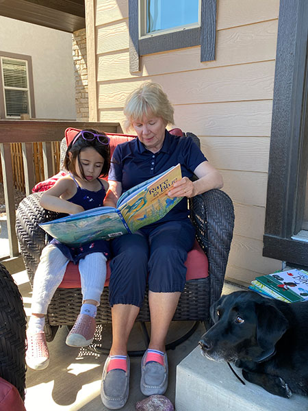 Priya and Grandma reading Rare and Blue